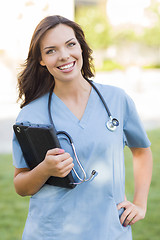 Image showing Young Adult Woman Doctor or Nurse Holding Touch Pad