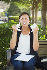 Image showing Upset Young Woman with Pencil and Crumpled Paper in Hands