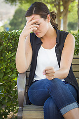 Image showing Upset Young Woman Sitting Alone on Bench