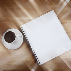 Image showing White cup and white page