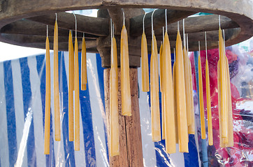 Image showing handmade wax candles hang retro wheel  rural craft 