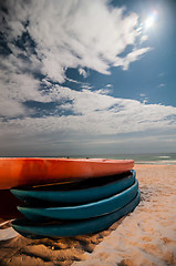 Image showing kayaks on the beach at night