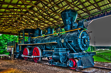 Image showing An old steam locomotive in a garage 