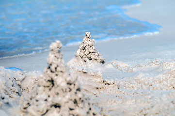 Image showing sand castle structures built at seashore