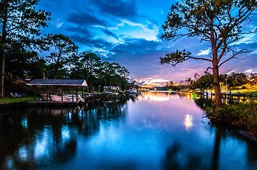 Image showing A Very Colorful Mythical Sunset Over water way near ocean