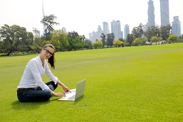 Image showing woman with laptop in park