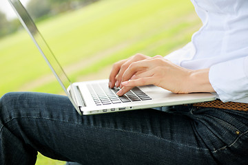 Image showing woman with laptop in park