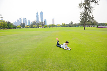 Image showing woman with laptop in park