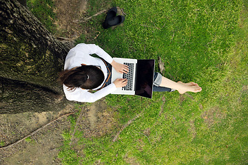 Image showing woman with laptop in park