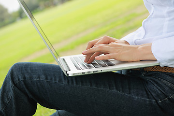 Image showing woman with laptop in park