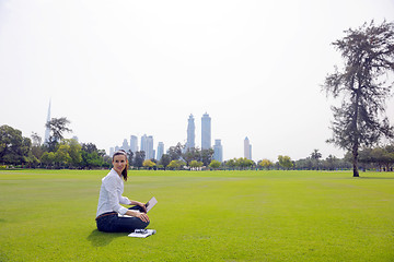 Image showing woman with laptop in park