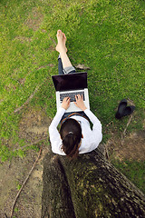 Image showing woman with laptop in park