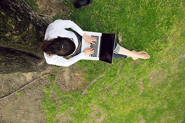 Image showing woman with laptop in park