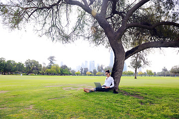 Image showing woman with laptop in park