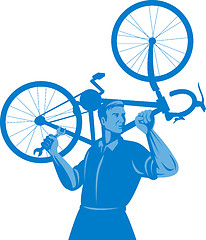 Image showing cyclist mechanic holding spanner and carry bicycle