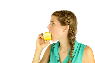 Image showing Girl taking a bite of an apple.