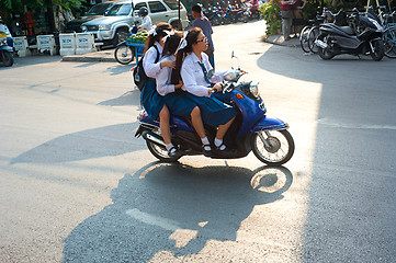 Image showing Schoolgirls on motorbike