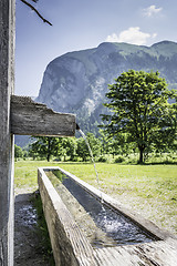 Image showing Drink fountain in Alps with mountains