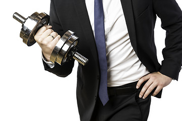 Image showing Businessman holding silver dumbbell