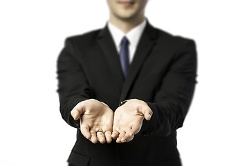 Image showing Businessman stretching out both hands