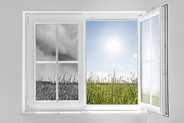 Image showing window with storm and sun