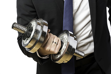 Image showing Businessman with silver dumbbell