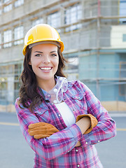 Image showing Young Attractive Female Construction Worker Wearing Hard Hat and