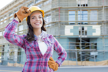 Image showing Young Attractive Female Construction Worker Wearing Hard Hat and