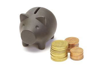 Image showing Black piggy bank and coins