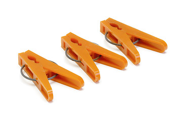 Image showing Orange plastic clothespins