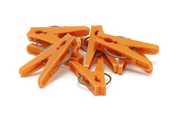 Image showing Orange plastic clothespins