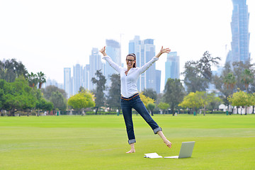 Image showing woman with laptop in park