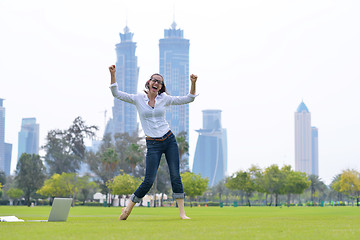 Image showing woman with laptop in park