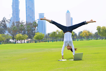 Image showing woman with laptop in park