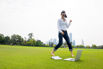 Image showing woman with laptop in park