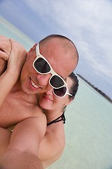 Image showing happy young  couple at summer vacation have fun and relax at bea