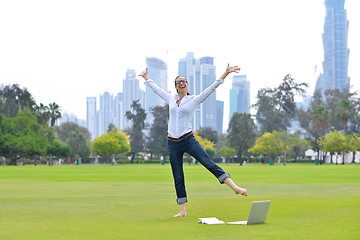 Image showing woman with laptop in park