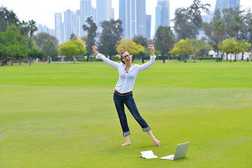 Image showing woman with laptop in park