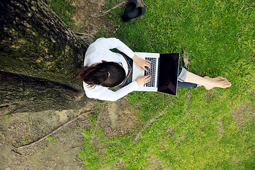 Image showing woman with laptop in park