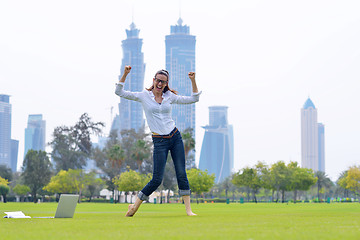 Image showing woman with laptop in park