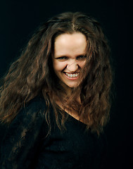 Image showing beautiful girl with long hair grins