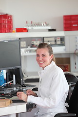 Image showing Smiling confident female technician