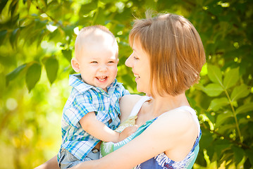 Image showing Mom and son playing outdoor together