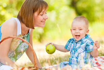 Image showing Mom and son have a picnic