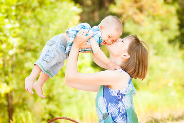 Image showing Mom and son playing outdoor together