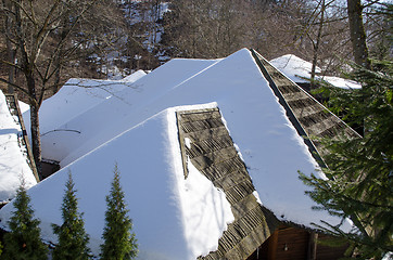 Image showing old village houses roofs cover snow winter forest 
