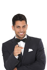 Image showing Handsome man in a tuxedo pointing