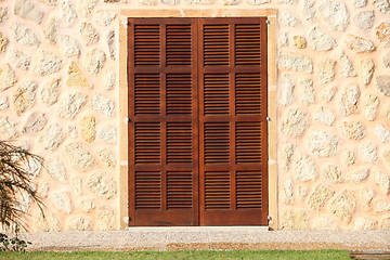 Image showing Shuttered window in a stone building