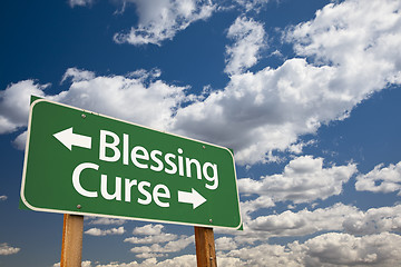 Image showing Blessing, Curse Green Road Sign and Clouds