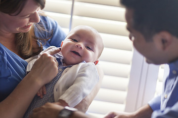 Image showing Mixed Race Couple Enjoying Their Newborn Son